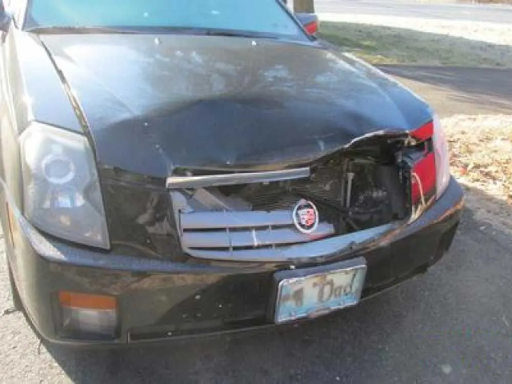 Cadillac with damaged grille